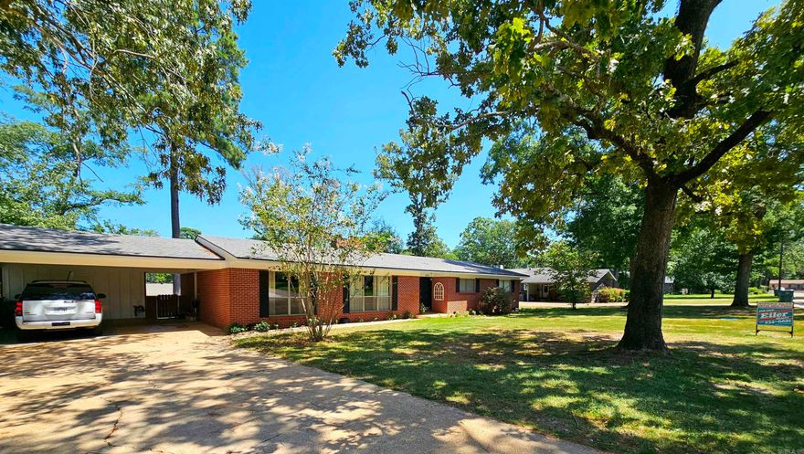 Updated Kitchen and Baths with granite counter tops. Large backyard with privacy fence. Two large living area's, both feature wood burning fireplaces. Large deck for entertaining.