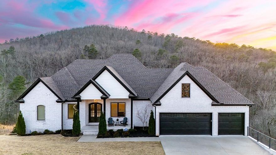 Experience elevated living in the exclusive Falstone subdivision of Chenal Valley. This pristine 5-bedroom, 3.5-bath home offers the feel of new construction and one of the most picturesque backdrops in West Little Rock. Nestled against a wooded mountain, the property showcases sweeping panoramic views from two spacious decks—ideal for entertaining or unwinding in total privacy. Inside, the thoughtfully designed open-concept layout features a gourmet kitchen that will impress any chef, seamlessly flowing into the main living areas for effortless gatherings. The main level boasts a luxurious primary suite, a custom-designed laundry room, and a generous three-car garage for added convenience. The lower level provides four oversized bedrooms, a large secondary living space, and a flexible bonus room perfect for a media room, home gym, or playroom. This exceptional home combines modern comfort with stunning natural surroundings in one of Chenal Valley’s most desirable neighborhoods. A rare opportunity you don’t want to miss.