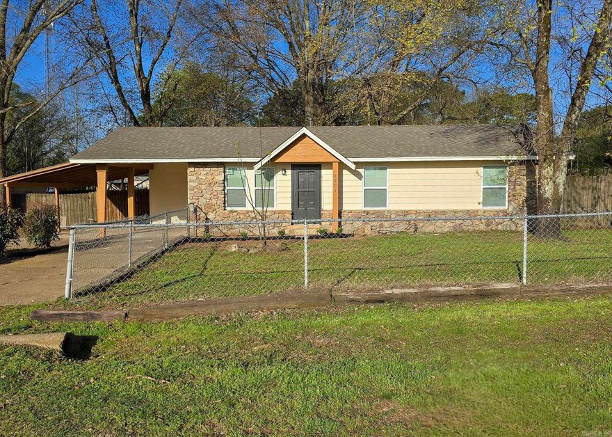 Fully Updated Benton Home with Modern Finishes!  Welcome to this beautifully updated home located in the near Benton! This property features a fresh, modern feel throughout with stylish upgrades that make it move-in ready.  Inside, you'll find new luxury vinyl plank flooring, neutral paint, and an inviting open living space filled with natural light. The completely updated kitchen features white shaker-style cabinetry, sleek countertops, stainless steel appliances, and modern black fixtures that give the space a clean, contemporary look.  The home offers a spacious living area perfect for relaxing or entertaining, while the functional kitchen layout provides plenty of cabinet and prep space.  Outside, the property includes a covered carport and fenced yard, providing convenience and privacy. Mature trees add shade and character to the property while the charming exterior stone accents give the home great curb appeal.  Conveniently located just minutes from shopping, dining, and easy access to Interstate 30