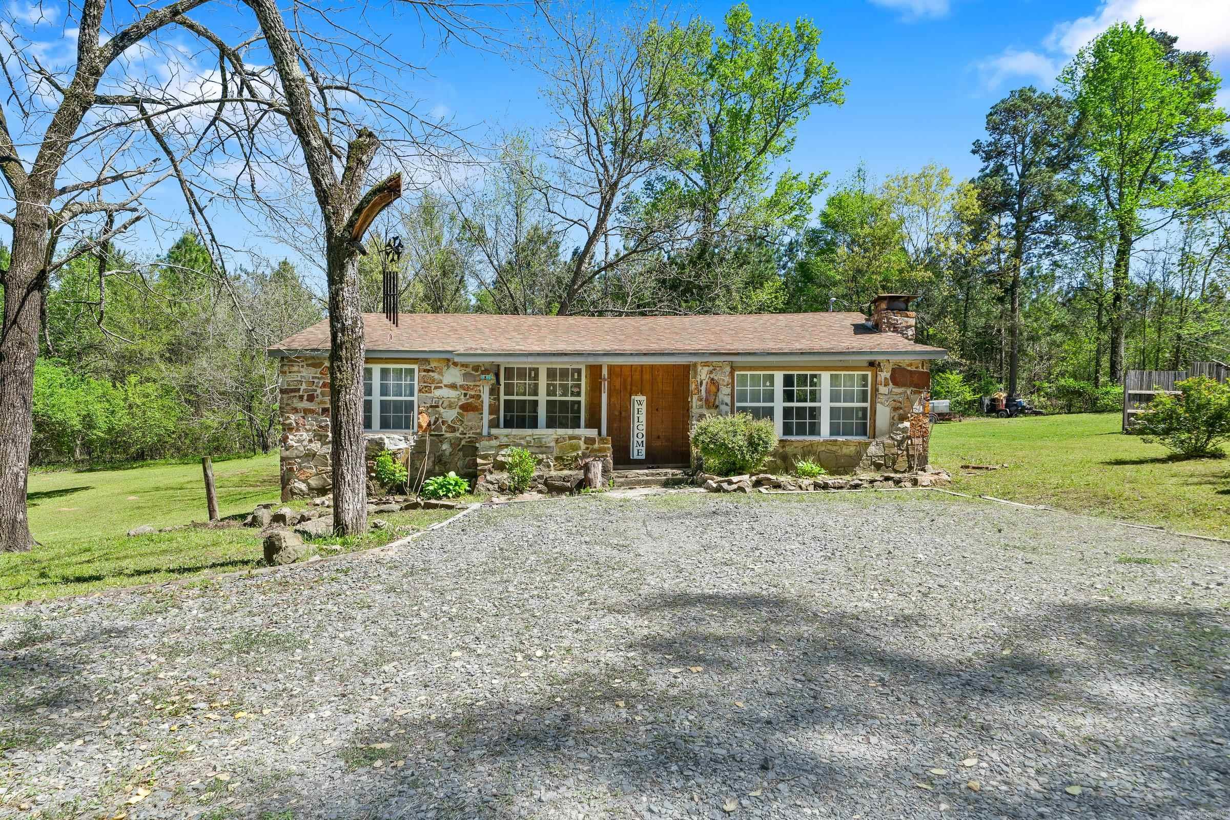 3 bedroom, 1 bath, rock home on approximately 2 acres +/- ,just minutes from De Queen. The home is approximately 1000 sq ft with CH&A, plus built on laundry room and porch. Remodeled kitchen includes granite countertops and nice cabinets. Ceramic tile and laminate flooring. Cute bathroom remodel and insulated windows.