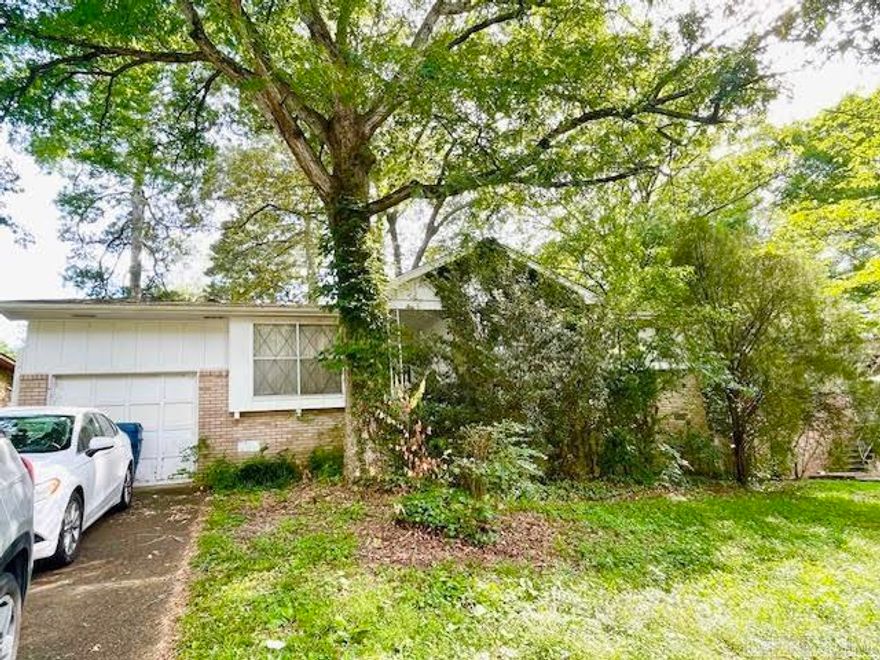 Cute home in an established neighborhood in Little Rock. This home would be a great home for your family or for an investment property. Home needs some TLC. It has a large back yard with a fence and a another fenced area for your dog. Covered patio for a get together or BBQ. Home had central heat but window unit A/C that is cold! There are gas lines with gas stoves as well. Home has a separate living area for movie nights. Seller does not know the age of anything and the stove does not work. Unsure of the double ovens. Home is being sold in AS IS condition with NO REPAIRS. SQ ft is approx please measure. Agents see remarks!