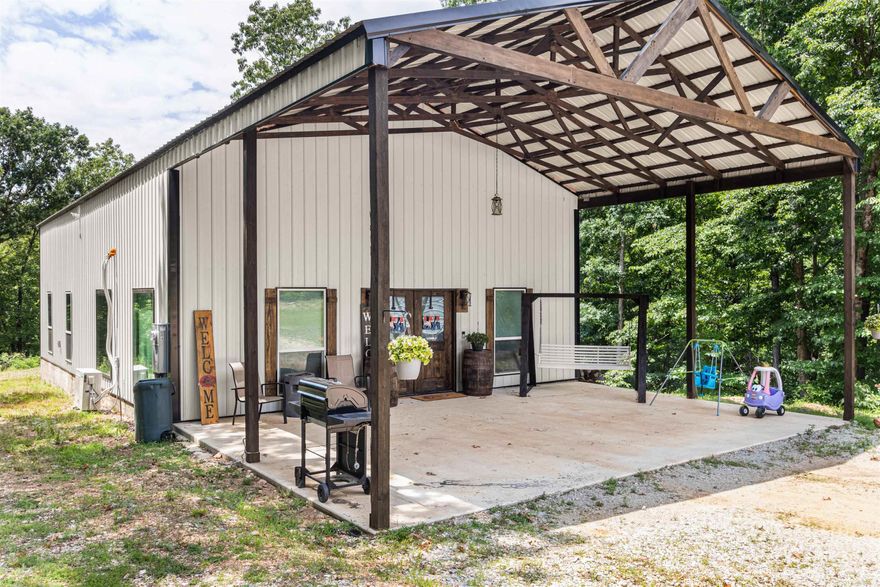 Nestled on 11.34 +/- acres of rolling land, this property is a hunter's paradise with abundant wildlife. As you approach the home, a spacious covered front porch and ample parking invite you inside to an entertainer's dream. Located in the Greene County School district, this home boasts two bedrooms and two bathrooms downstairs along with an open living room, kitchen, and dining area perfect for gatherings. The large laundry and pantry provide plenty of storage space while the primary suite attached to it offers ample space and flows to the laundry room. The spare bathroom has a custom tile shower. Throughout the home you will find other unique features like repurposed barn wood and metal tin that make this home truly one-of-a-kind. Upstairs features a large loft that could serve as a second living room or office or even converted into a third bedroom if desired. Additionally, there is plenty of storage space with a large closet upstairs as well. Don't miss out on your chance to own this stunning property! Loft still has an open space without railing to accommodate moving furniture. Additional railing can be added at closing.