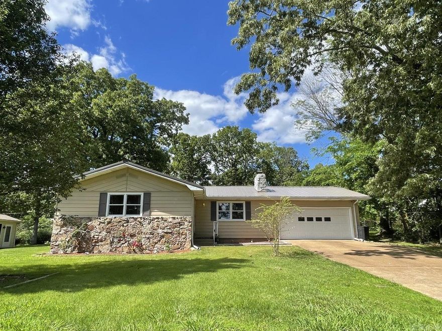 Refreshed, move-in-ready 3-bedroom 2-bath 1260 sq ft home with a 2-car garage. Home features open floor plan, fireplace, separate laundry room/storage, metal roof, and a 456 sq ft private back deck. Great location, walking distance to Crown Lake and public fishing pier. Minutes to local amenities. Located on a quiet street ending in a cul-de-sac. Surrounded by a variety of wildlife and exotic birds. What we love: Very comfortable home. Enjoy sitting out on the back deck early morning listening to and watching the birds. Friendly, great neighbors. A forested park-like view out the dining room sliding doors and kitchen window. Convenient location.