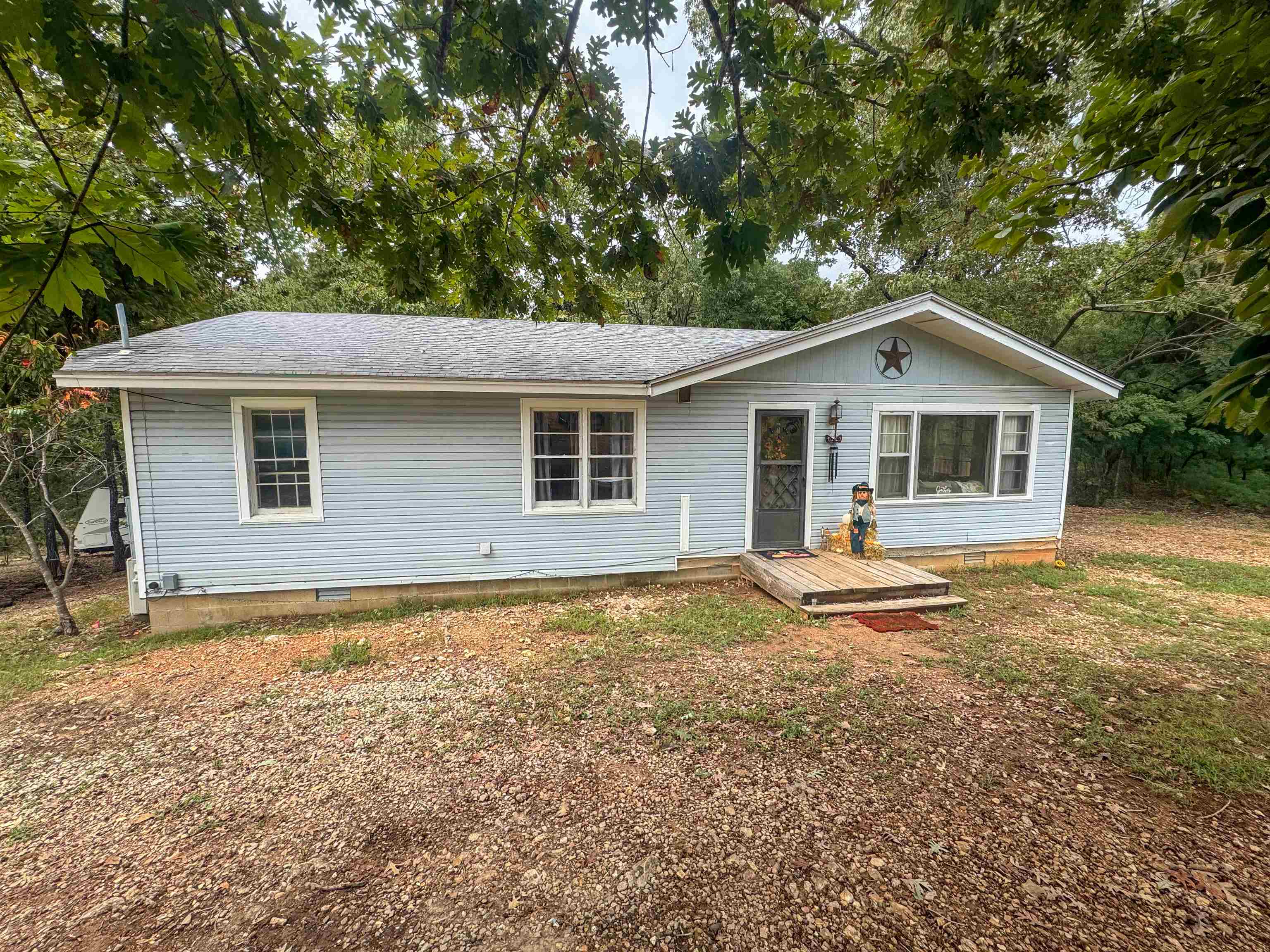 Fall in Love with Highland Charm! 2541 Hwy 62/412, Highland, AR. LOCATION! LOCATION! LOCATION! Nestled right on Hwy 62/412, this quaint 3-bedroom gem offers unbeatable convenience. Just steps from restaurants, shopping, grocer, and local businesses. Whether you're commuting, investing, or simply craving walkable living, this address delivers. Home Highlights: Charming circle driveway for easy access. Three cozy bedrooms and one oversized bath. Spacious living room perfect for gatherings. Functional kitchen and dedicated dining area. Relaxing back deck overlooking three generous lots. This smaller but mighty home is full of potential--ideal for first-time buyers, downsizers, or investors lookin for prime highway frontage. Come See why this Highland haven is the perfect place to plant roots and fall in love. Schedule your showing today.