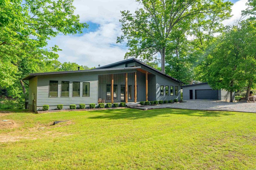Welcome to riverfront living at its finest on the Little Red River. This stunning 4-bedroom, 5.5-bath home is elegant, great for entertaining, and making unforgettable memories—and is being sold fully furnished, making it truly move-in or rental ready. Each bedroom has its own private bathroom and access to step outside to a beautiful back deck overlooking the river, complete with a gas fireplace—perfect for relaxing evenings year-round. Enjoy direct water access with your own private dock, plus a fire pit area ideal for gathering with family and friends. Inside, the home offers something for everyone, including a large bonus room perfect for kids. The open living area features a grand stone gas fireplace and views of the river, while the oversized dining table provides the perfect setting for hosting large gatherings. The bonus area includes a pool table. The oversized laundry room is a standout feature with two washers, two dryers, and a convenient folding island—designed to handle it all with ease. A detached garage provides additional storage for toys. Whether you’re looking for a full-time residence, weekend getaway, or income-producing investment, this property will provide.