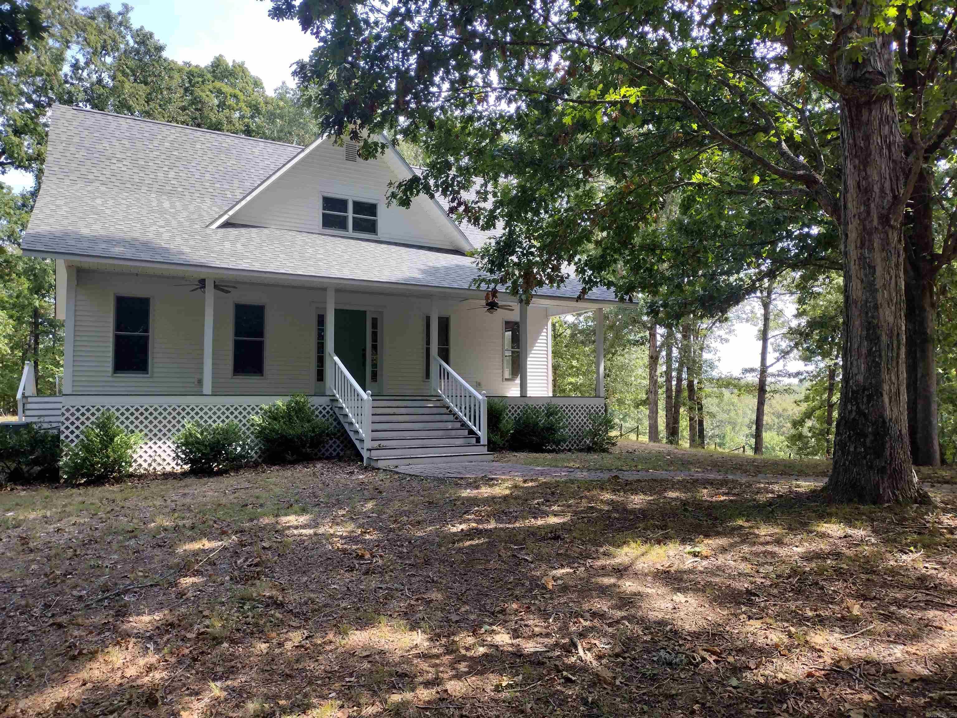 This stunning home, nestled on 5.10 acres boasts two master bedrooms, one on each level, a large living room, and delightful porches ideal for enjoying the picturesque views, offering a peaceful retreat just a short distance from town yet maintaining a sense of seclusion would make great hobby farm.