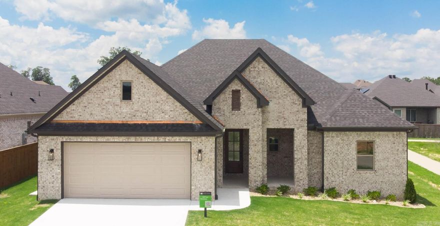 Discover your dream home! This charming 4-bedroom, 3-bathroom brick residence offers 2,492 sq ft of elegant living space. The spacious primary suite serves as a private retreat, complete with a luxurious en-suite bathroom and ample closet space. Enjoy the outdoors on your covered front and back porches, perfect for relaxing and entertaining. Inside, you'll find a well-designed layout with a modern kitchen and open living areas that cater to both daily living and hosting guests.  **Estimated Completion Early 2025**