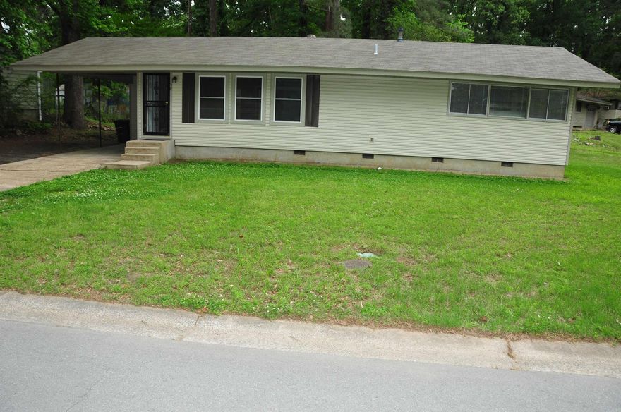 Charming single-story ranch-style home situated on a spacious 0.56-acre lot in southwest Little Rock. Inside, you'll find a functional floor plan featuring a comfortable living area, central heating and cooling, and washer/dryer connection. and newer Vinyl Plank flooring throughout, and fresh paint, while the home also offers convenient covered parking with a carport. The oversized lot provides plenty of room for outdoor enjoyment, expansion, or future improvements—ideal for buyers looking for space and flexibility. Located with easy access to major roads, shopping, and schools, this property is a great opportunity for a primary residence, rental, or value-add investment.