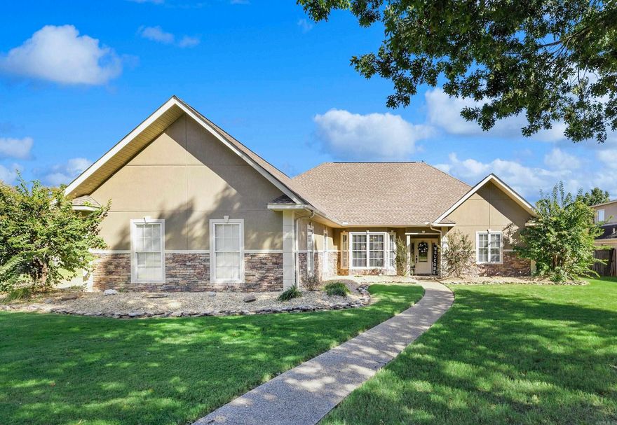 ONE LEVEL HOME IN HURRICANE LAKE ESTATES! Step inside the inviting foyer and into the vaulted-ceiling living room with gas fireplace, complemented by rich wood floors and abundant natural light. The kitchen features granite countertops, a breakfast bar, breakfast area, gas range, and nearby formal dining—perfect for everyday meals or entertaining. The oversized primary suite is a private retreat with a tray ceiling and an updated spa-like bath showcasing a custom tile shower, freestanding tub, double vanities, and a walk-in closet with French-door access to the covered porch. The additional bedrooms are on opposite side of home and have large closets. Outside, relax in the hot tub or enjoy the built-in grill and spacious flat backyard ideal for year-round gatherings. and Don’t forget the oversized side loading garage! Full size gate entry to the backyard, new roof in 2020 and new hot water tank in 2021!!!