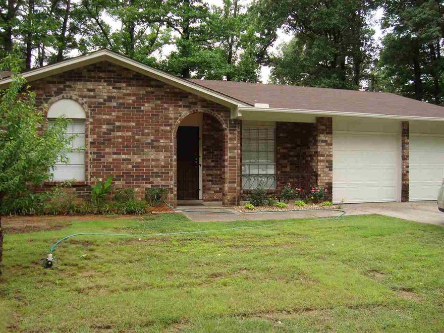 This home has been renovated from top to bottom. Cabinets refaced and look great.  New countertops and stove in kitchen. New paint throughout. Both bathrooms redone with nice tile surround. Carpet and tile floors all new. Both garage doors just replaced.  New siding on the rear. HVAC approximately 3 years.  Featuring a living room and large den with wood burning fireplace. Nice landscaping and decorative porch rail. New roof 2011. Owner will pay closing costs and provide home warranty with acceptable offer.