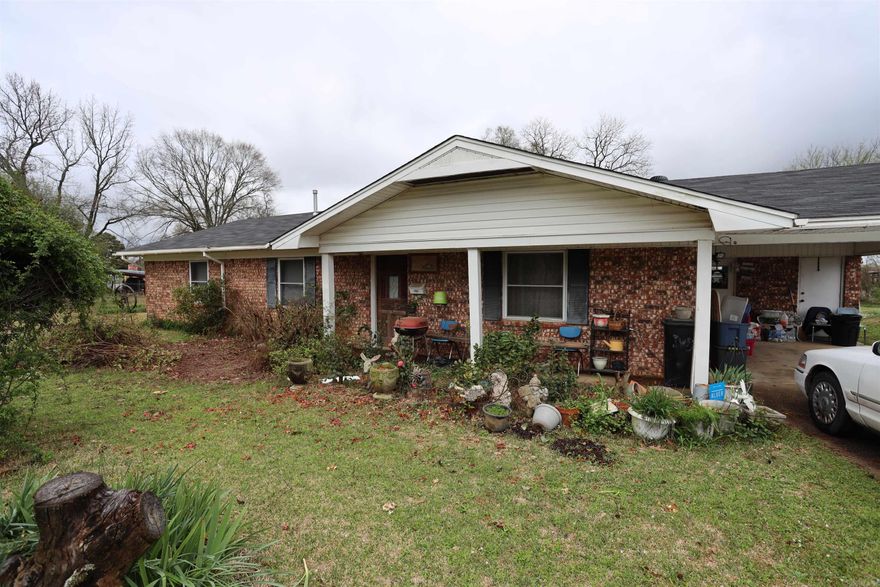 This is a nice Brick home with a two year old roof. It comes with a storm shelter, three outbuildings and a nice yard. This could be your starter home or forever home!  (There are no pictures of the inside of the home at this time.)