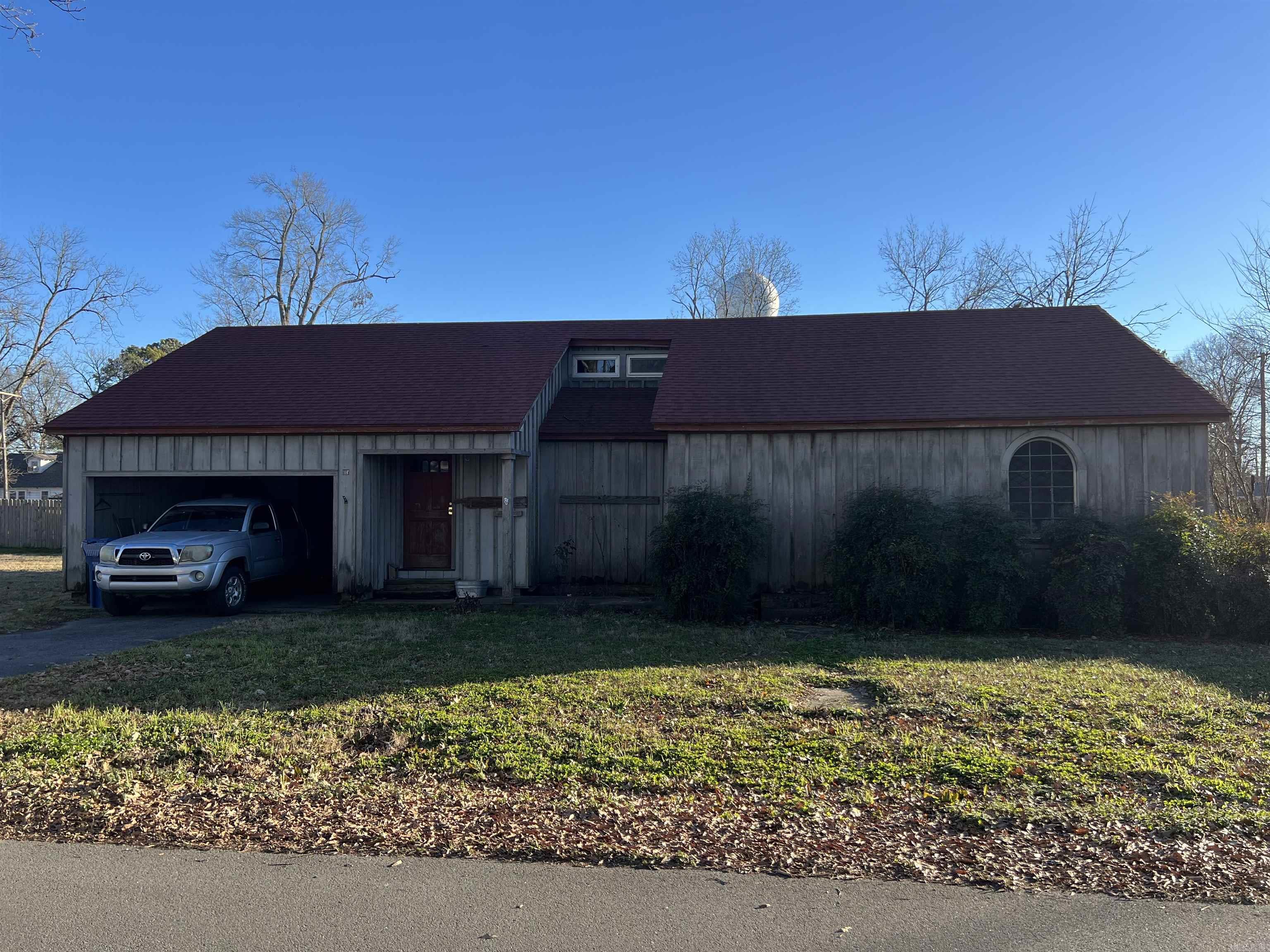 Nice house that has a large flat yard in the Heart of Carlisle. 3 bedrooms with with a huge great room. Enclosed back patio. Needs some TLC and updating. New roof a few years ago. Conventional loan, or Cash only. AS IS. Seller Will not make any repairs.