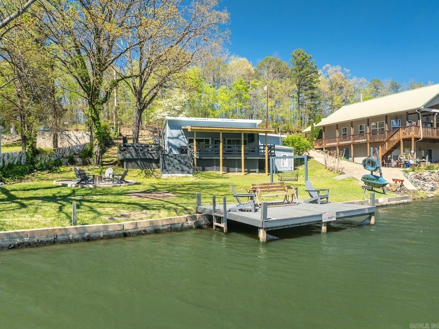 Lakefront Oasis in Hot Springs, AR! This is an excellent short term rental investment property, with a transferable active STR license from the city of Hot Springs.  - LAKE FRONT - 5 MIN FROM OAKLAWN - PROVEN REVENUE RESULTS