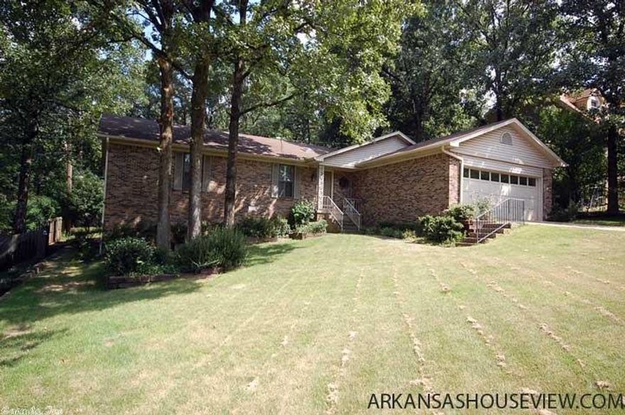 Beautiful well-maintained 3bed/2bath home. Large living room with vaulted ceilings-fireplace-built-ins. Plantation Shutters!  Kitchen has updated appliances.  Large bedrooms.  Master bedroom is huge with built in desk/cabinets with large walk-in closet. New hardwoods, siding, windows, fresh paint and fence. Sunroom off living room. 814sqft  humidity controlled basement that is heated/cooled with office/workshop w-walk out access.  Nice shaded private back yard that backs up to wooded tree line.