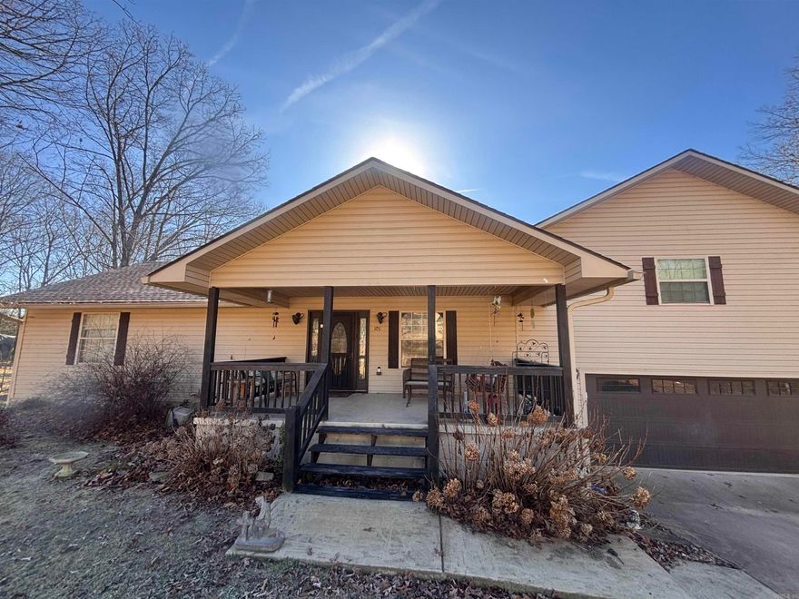 Welcome to this cozy 3 bed, 3 bath home nestled right here in the Ozarks. Less than 10 minutes from the historic downtown Mountain View known for its rich folk music, and welcoming community. My favorite features of this home include the master bedroom with vaulted ceilings and a balcony for morning coffee, the master bath with its soaker tub, tiled shower, and walk-in closet, and the bonus sunroom which has endless possibilities. Enjoy the nature view from the large deck overlooking the fenced in back yard. Roof was replaced a year ago. There are two waters heaters and two AC units, one was just recently replaced and the other is less than 10 years old.