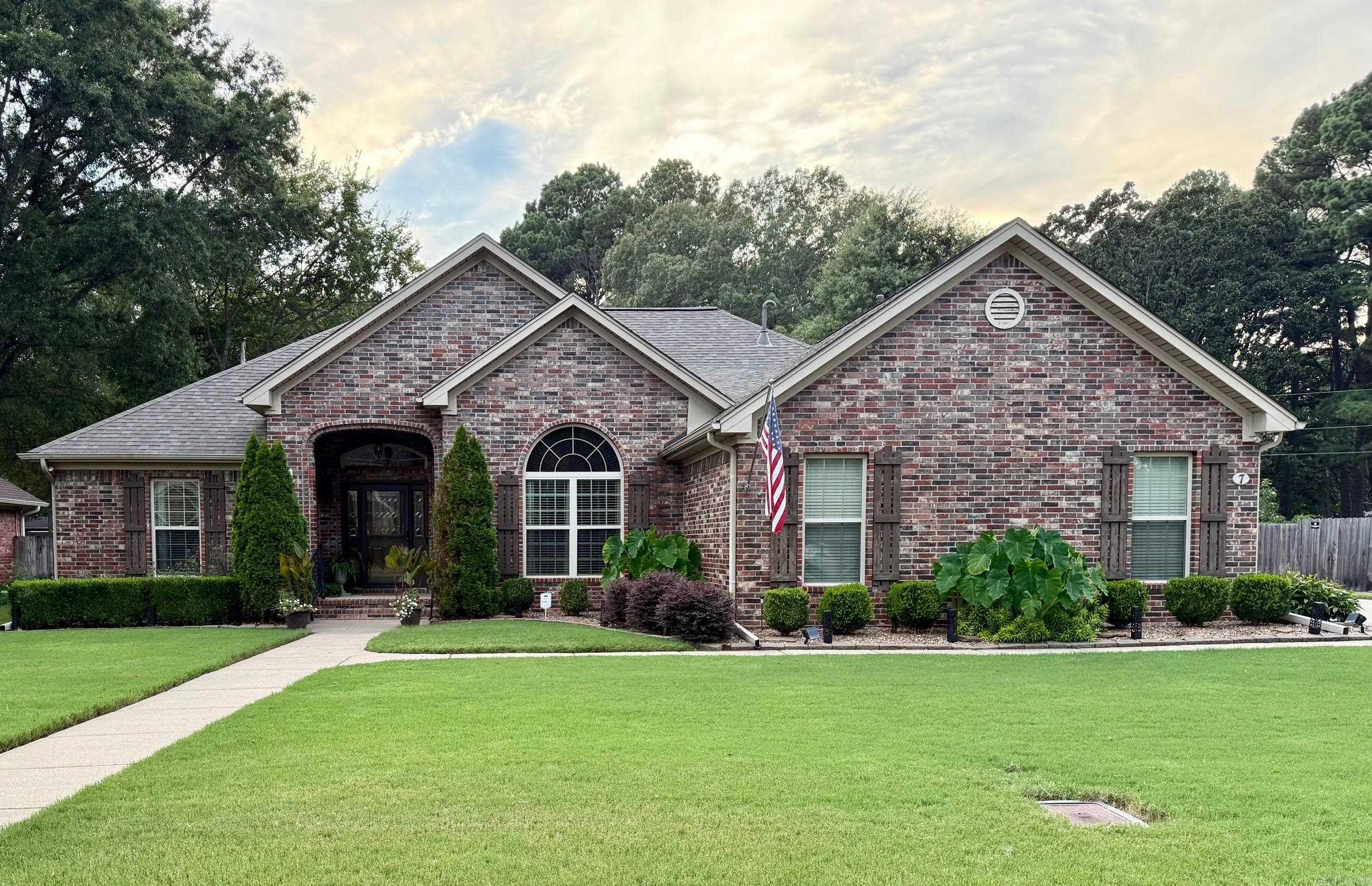 Discover this hidden gem in East Conway, close to shopping with easy access to I40, in a quiet, established Subdivision. The tall ceilings in the living & dining rooms add a touch of elegance as you enter the home. Beautiful crown Moulding through out. The floors are true hardwood and tile in all the wet areas. The bedrooms are a split plan with the two spare bedrooms sharing a bath located between them. The kitchen and both baths have granite countertops. The garage is oversize with a storage room and cabinetry in it. Beautifully maintained yard, both front and back.. Sprinkler system covers yard and flower beds. Out the backdoor is a two tiered covered patio with a tv. The trees on the lot behind the property keep the patio shaded in the evening. Both tiers have ceiling fans for added comfort for a relaxing outdoor experience. The living spaces have beautiful windows that bring in satisfying natural light. The driveway is a concrete double size to add extra parking
