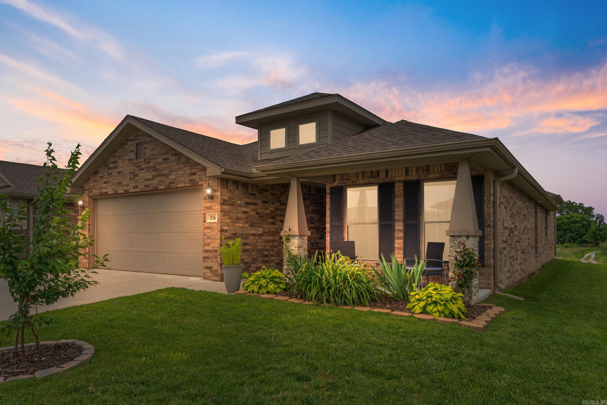 Welcome home! Immaculate, move-in ready home located in desirable Woodward Hills. This beautifully upgraded property features hardwood floors and ceramic tile throughout, granite countertops, and soft-close kitchen drawers. Additional highlights include bullnose corners, stainless steel appliances, seamless guttering, granite countertops, 30 year tamko shingles, 15 seer HVAC, custom cabinetry, a Nest thermostat, in-wall HDMI wiring, motion-sensor lighting in the utility room, wireless garage keypad entry, and faux wood blinds in every room. Enjoy cozy evenings by the fireplace and take advantage of the attic ladder for convenient extra storage. The home is attractively landscaped and offers a stunning pasture view from the backyard. Schedule your showing today!