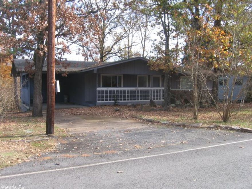 Updating in progress -- YOU finish!  Carpet gone, down to subflooring, except kitchen has new vinyl tile.  "Popcorn" ceiling is removed & primer applied, ready for paint.  Walls also ready to paint.  Kitchen has new countertops, sink/faucets, hardware, lights -- you add appliances.  Bathrooms in good shape.  Nice rear deck that's covered.  Get out your paint & brushes, order some flooring and appliances, efficient HVAC & you'll be ready to move in, rent, or re-market. SUPER price to make this do-able.
