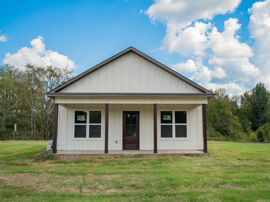 **Motivated seller, make an offer!** Charming modern farmhouse! This 1,040 sq ft- 2 bed, 2 bath home sits on 10 acres. It features an open concept layout, brown tile flooring throughout, custom kitchen cabinets, and black granite countertops. Neutral color palette with modern finishes. Kitchen is equipped with Samsung refrigerator, stove, and dishwasher. Property offers ample space for a small homestead or outdoor recreation. Enjoy country living with quick access to Arkadelphia conveniences. Located just 10 minutes from town!