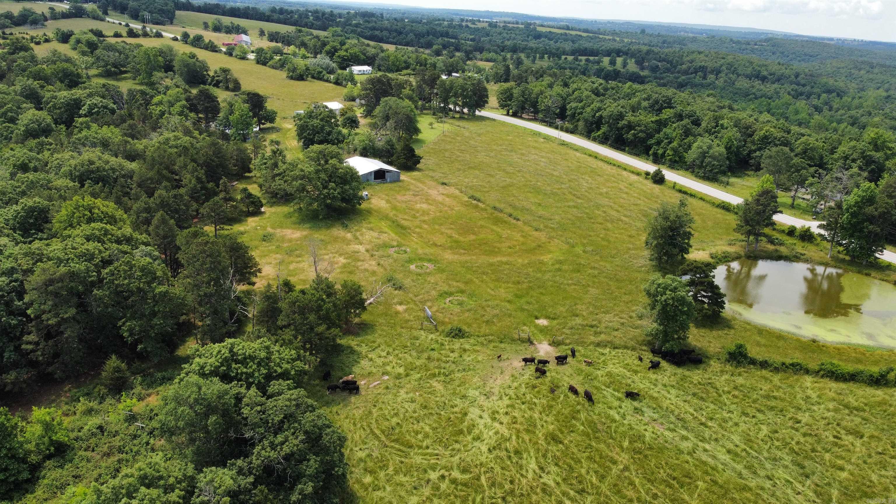 70-Acre Farm & Recreational Retreat ā Just 15 Minutes from Mountain View! Discover your own slice of Ozark paradise with this versatile 70-acre property offering the perfect blend of country living, farming potential, and outdoor recreation. This beautiful tract features a cozy 2-bedroom home, a large shop, hay barn, and is fully fenced ā ready for livestock or your next adventure. The land is a balanced mix of open pasture and mature woods, ideal for hunting, hiking, or riding. Three stocked ponds provide excellent fishing and water sources for animals. An additional mobile home on-site offers potential for rental income, guest quarters, or multi-generational living. Whether you're looking to homestead, run a small farm, or escape to the country, this property delivers. All just a short 15-minute drive from the shops, restaurants, and charm of Mountain View. Donāt miss this rare opportunity ā schedule your private tour today!