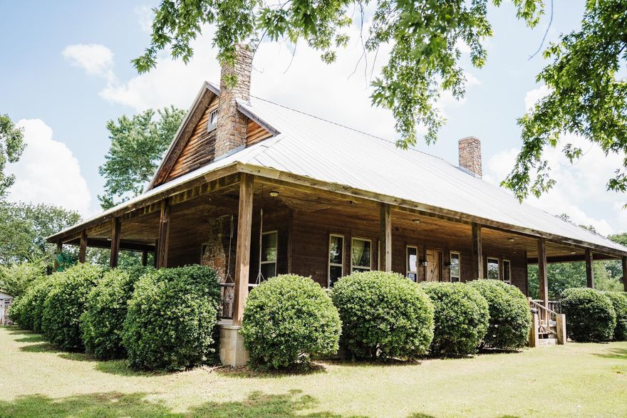 This remarkable farm home is loaded with character and situated on 35 acres of pastureland that serves as the site of a pure sorghum molasses mill and an equestrian haven with the most beautiful sunsets you have ever seen! The property offers endless possibilities with fertile pastures, cross fencing, gated entrance, prime hunting grounds, two wells, rural water, a large-stocked pond, and tons of wildlife just outside your doorstep; all conveniently located within a short drive to the cities of Russellville, Clinton, or the Gulf Mountain Wilderness area and all the outdoor activities Arkansas has to offer. This home was custom build in 2013; but has the warmth and comfort of a true farmhouse with a wide covered wrap around porch, two large authentic rock fireplaces, 100-year-old hand hewed beams, vintage doors and sinks, hickory cabinets, cedar lined walls, hardy wood furnace and a utility basement that serves as a storm shelter as well. This home also features energy efficient quaker windows, spray foam insulation, a utility lift, central HVAC, geothermal AC and a swimming pool. This home is truly exceptional and must be seen in person to appreciate all it has to offer!