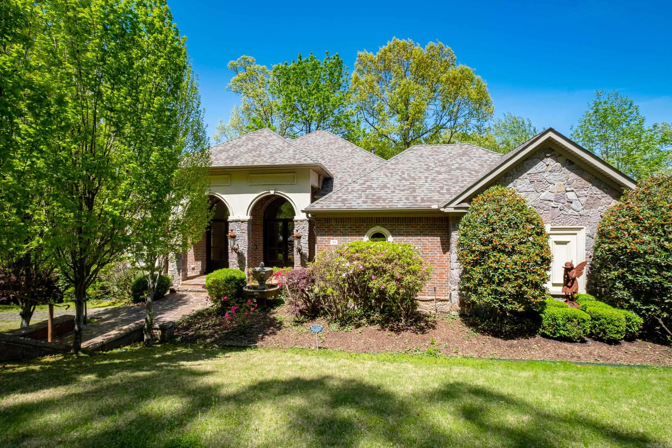 Welcome to this Exclusive gated Greathouse Bend Estate home. Enter the home on natural stone tile in the main living areas. The Great Room has ceiling-to-floor windows giving a great seasonal view of the Ark River and a private backyard. The oversized kitchen island offers lots of room for visiting with family & friends while entertaining. The sliding glass doors lead to a balcony with great shade from the mature trees. The primary bedroom is located on the main level, while the split to the rear level has a guest suite with two more bedrooms and a bath. The bonus room has built-ins and a newly added 250 Sq. Ft. the office recently completed. See agent remarks.