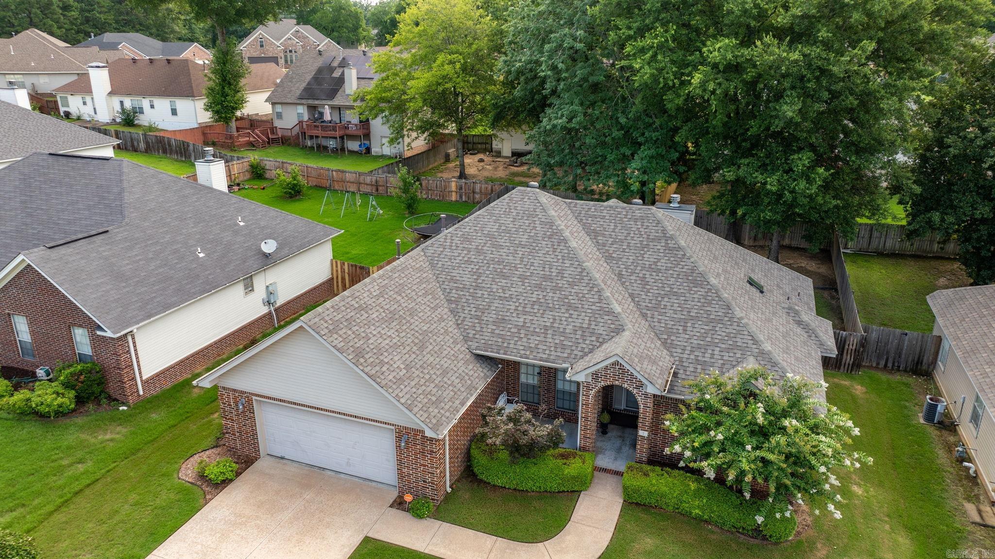 Beautifully maintained ONE OWNER home in established gated community with clubhouse, pool, tennis courts, and walking trails that are perfect for any lifestyle. This spacious and inviting 2,000 sq ft home is located on a quiet cul-de-sac. Step inside the foyer from your covered front porch to an open and airy great room with a cozy fireplace and tray ceiling. Elegant formal dining room with soaring ceilings, and detailed crown molding and trim throughout that could be repurposed. The freshly painted kitchen features a center island, ample cabinetry, newer refrigerator and a casual dining area, ideal for family gatherings. The split-bedroom floor plan provides privacy and functionality, with large secondary bedrooms and plenty of closet space. The oversized primary ensuite has a relaxing bath, skylight and generously sized custom closet. Step out back to a large level fenced backyard, mature landscaping and serene patio, idea for relaxing outdoors and oversized garage. This meticulously well-loved home combines charm, function, location, NEWER HEATING AND AIR AND NEW ROOF! Alarm conveys and move-in ready. Did I mention the one year third party home warranty? Welcome home!