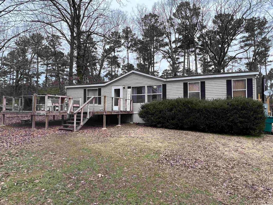 Home sweet home! Looking for an exceptionally well-maintained home with 3BR and 2BA? Here it is! Sitting on almost half an acre, this open floor plan home is MOVE IN READY! Features include: new paint inside, new LED lighting throughout, new roof (2019), new water heater (2019), A/C less than 10 years old, city sewer and all electric, brand new back/side deck, and a great front deck for relaxing. Don't miss your chance to see this one! See agent remarks.