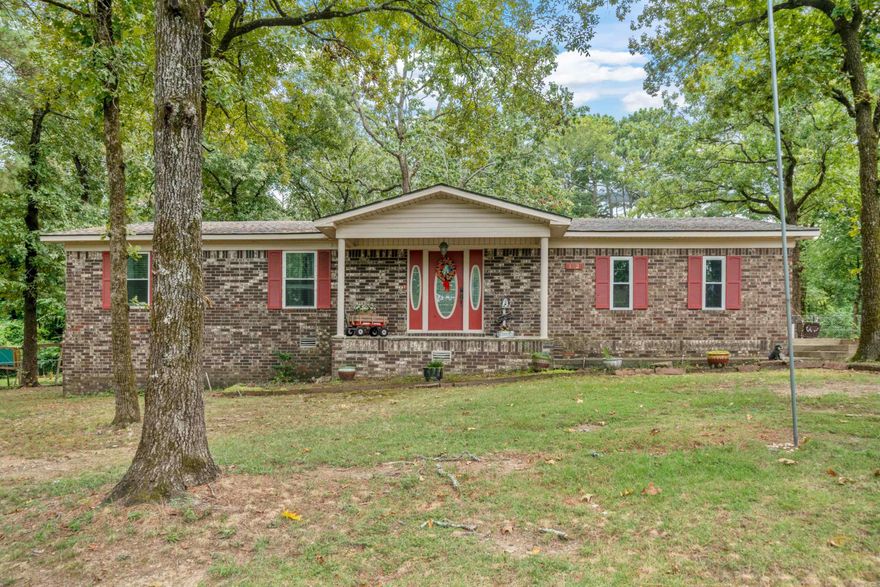 This 3 bed, 2 bath Lake Hamilton School District home on just under an acre is a must see!  Tucked away on a low traffic lane just off Marion Anderson, this brick and siding home has a large lot, fully fenced & mostly flat back yard and covered patio (wired for hot tub) perfect for entertaining!  Log outbuilding and garden shed both wired for electricity, and even a 30 amp RV hookup.  Updates to the home include fresh paint, carpet, vinyl plank flooring, recessed lighting, GFCI's, new fixtures, smart garage door, 2 year old roof & soffits and a 6 month old water heater.  Don't let this one pass you by!  Call for your showing today!