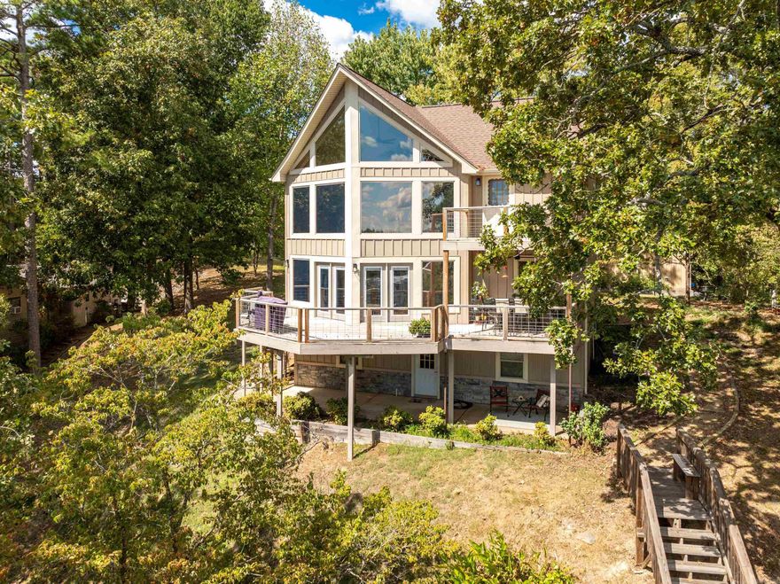 This exquisite custom-built, owner-occupied 3-bedroom, 2.5-bath residence spans an impressive 2,600 square feet and offers panoramicviews overlooking the beautiful Lake Hamilton. Enjoy the generous living space spread over three thoughtfully designed stories, perfectfor family gatherings or entertaining guests. Recent Updates: New roof installed in 2023, Six-year-old HVAC system (two units foroptimal comfort), New partial siding recently completed, All windows replaced with low-E gas for energy efficiency, keeping your homewarm in winter and cool in summer. The boat slip and steps to the water, completed in 2019, make launching your boat or enjoying wateractivities a breeze. Both decks were replaced in 2023, providing perfect spaces to relax while soaking in the stunning lake views. heproperty boasts a large 30x32 shop with two garage doors, equipped with PVC air compressor piping and 220 outlets to accommodateall your large electrical needs—ideal for hobbyists or additional storage. Nestled in a tranquil setting, this home combines the serenity oflake living with easy access to local amenities. Whether you enjoy fishing, boating, or simply relaxing by the water, this property offe