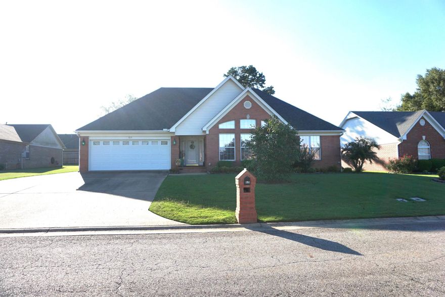 Beautiful home with so many recent upgrades. New flooring, granite countertops in kitchen and bathrooms, new stone backsplash, and all stainless appliances. The roof was replaced in 2022. Lots of windows in the LR for natural lighting, but have been nicely tinted. Beautiful custom tile walk in shower with glass doors in the primary bathroom. All bedrooms have walk in closets and some have double walk in closets. Kitchen has a ton of pretty white cabinets and lots of storage. Nice area for a dining table that is very open to the living room. The concrete driveway was extended for extra parking.  Covered back patio and beautiful landscaping and inground sprinkler system. Privacy fenced back yard with a wonderful brick storage building that has a welcoming front porch perfect for sitting and enjoying your private back yard.  There is also a potting shed area behind the building for all you flower repotting people or can just be used for extra storage. The house is all electric but gas has been ran for the gas log fireplace for backup heat source. Sellers are downsizing and their condo will be ready the first week of November so the closing date has to be on November 7th or after.