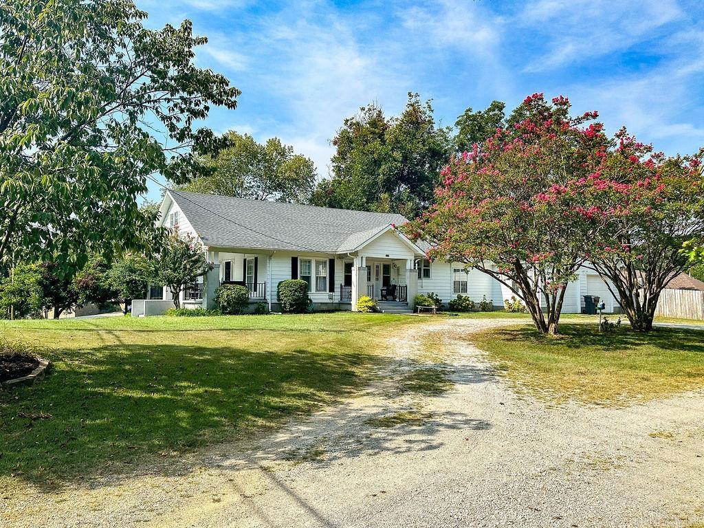 Discover timeless charm in this beautiful Craftsman-style bungalow perched on a landscaped hilltop lot over 3/4 of an acre. This 3-bedroom, 2-bath home offers inviting spaces inside and out, including three porches perfect for relaxing or entertaining. A wood privacy fence around the backyard makes it feel secluded. Inside, the home is filled with characterātall ceilings and crown molding grace the main level, while upstairs youāll find beadboard walls and ceilings that enhance the classic Craftsman style. The primary suite features its own sitting area, creating a private retreat. A loft and bonus room provide flexible space for an office, playroom, or guests. Practical features include a 2-car garage and a basement for extra storage. With so much personality and thoughtful design, this home is just minutes from ASU and everything Jonesboro has to offer.