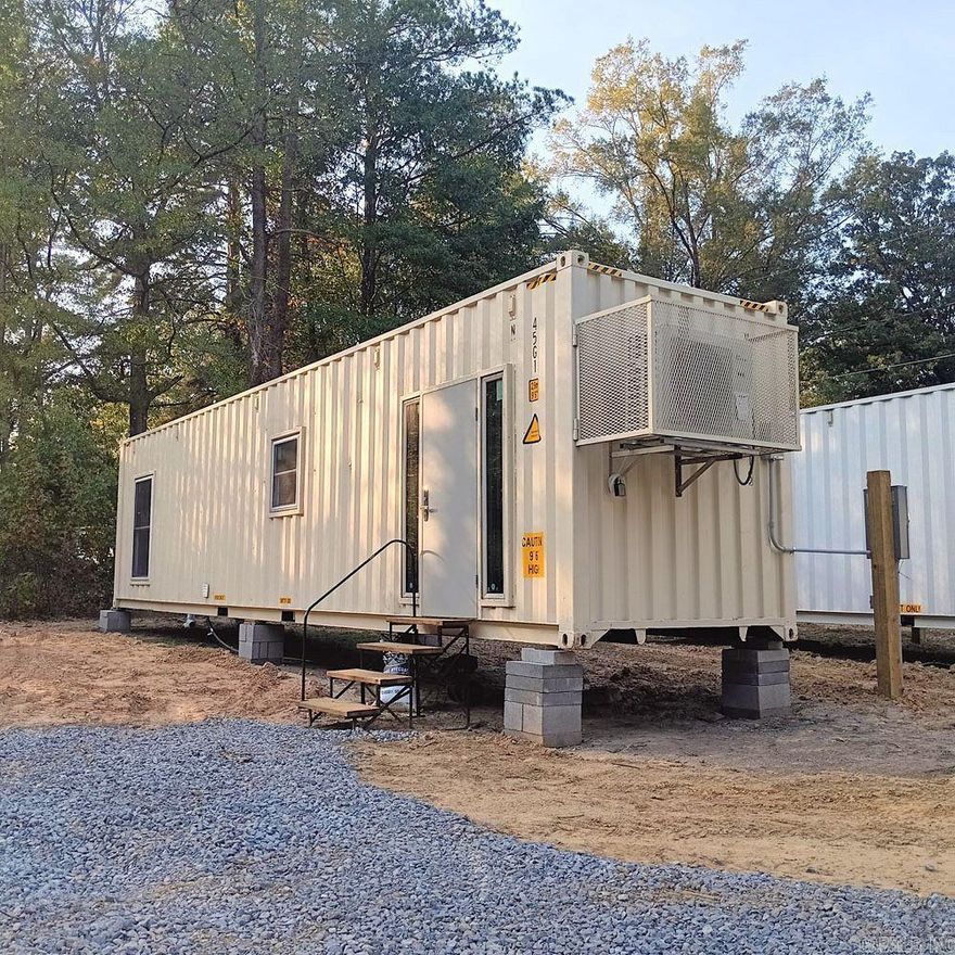TWO NEW TINY HOMES ON ONE LOT! Live in one and rent the other one. Great rental potential! These new homes are situated on a corner lot in Watson Chapel School District, near Pine Bluff.  The lot is .85 acres in size (37.026 SF). The tiny homes are 40' x 8' x 9'.  The first home has a gas stove.  The second home is all electric.  The homes will be sold together on one lot.  The septic system is completed.  Water and electricity have been connected.  There is a paved driveway plus a graveled area for off road parking for up to five vehicles.     The homes each have 1 bedroom and one bathroom, with walk-in showers.  The kitchens have plenty of cabinet space.  Mini Splits heat and cool the homes, plus window units have been placed in the bedrooms for privacy.  The walls have R-17 insulation ratings and the ceilings have R-30 insulation ratings.   There are washer and dryer connections for stacked units in both homes.  The floors are covered with luxury vinyl plank flooring from end to end.
