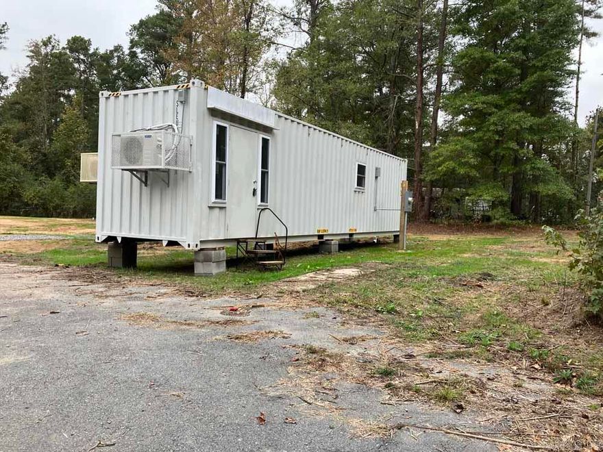 TWO NEW TINY HOMES ON ONE LOT! Live in one and rent the other one. Great rental potential! These new homes are situated on a corner lot in Watson Chapel School District, near Pine Bluff.  The lot is .85 acres in size (37.026 SF). The tiny homes are 40' x 8' x 9'.  The first home has a gas stove.  The second home is all electric.  The homes will be sold together on one lot.  The septic system is completed.  Water and electricity have been connected.  There is a paved driveway plus a graveled area for off road parking for up to five vehicles.     The homes each have 1 bedroom and one bathroom, with walk-in showers.  The kitchens have plenty of cabinet space.  Mini Splits heat and cool the homes, plus window units have been placed in the bedrooms for privacy.  The walls have R-17 insulation ratings and the ceilings have R-30 insulation ratings.   There are washer and dryer connections for stacked units in both homes.  The floors are covered with luxury vinyl plank flooring from end to end.