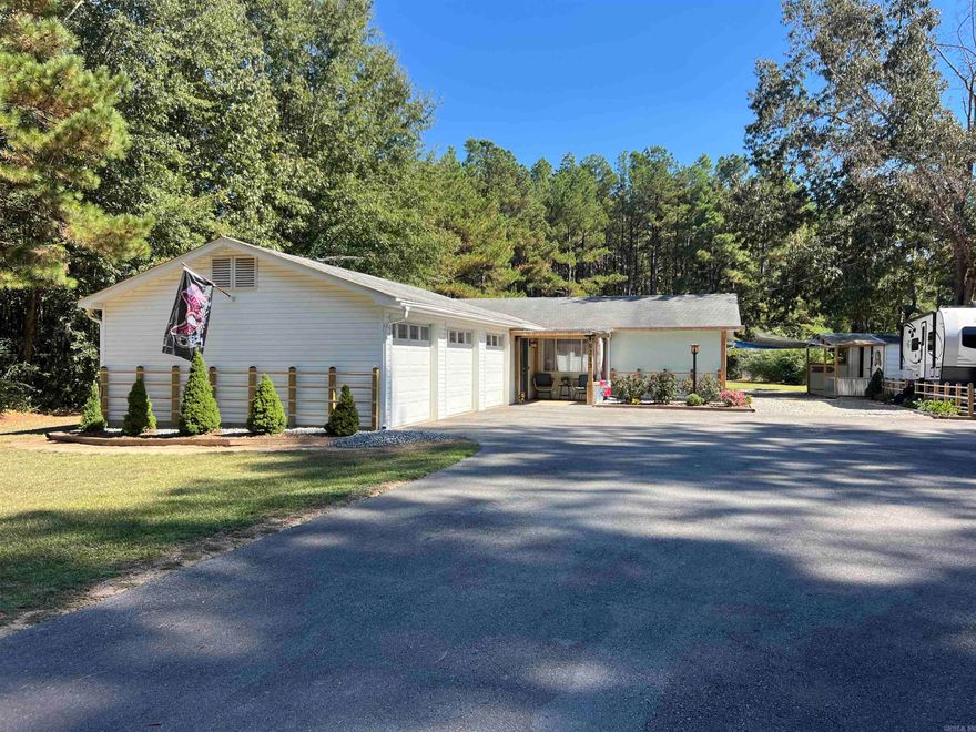 This beautifully remodeled 2-bed, 2-bath home sits on over an acre of land and features a versatile bonus room that could accommodate a third bedroom, study, or home office. It has a large sunroom currently being used as a sewing room.  The stunning kitchen boasts brand-new appliances, countertops, backsplash, lighting, and flooring, while the updated bathrooms offer modern elegance. Enjoy year-round comfort with a new HVAC system and water heater and new roof.  Outside, you'll find new landscaping, new septic system, a fenced yard, a storage shed with a porch, and a spacious back porch with a cozy sitting area. The home also includes built-ins, a hidden safe, a new front door, and a front-load washer & dryer. It has a three-car garage for an extra vehicle. Relax on the charming front porch and enjoy the peace and privacy of this beautiful property!