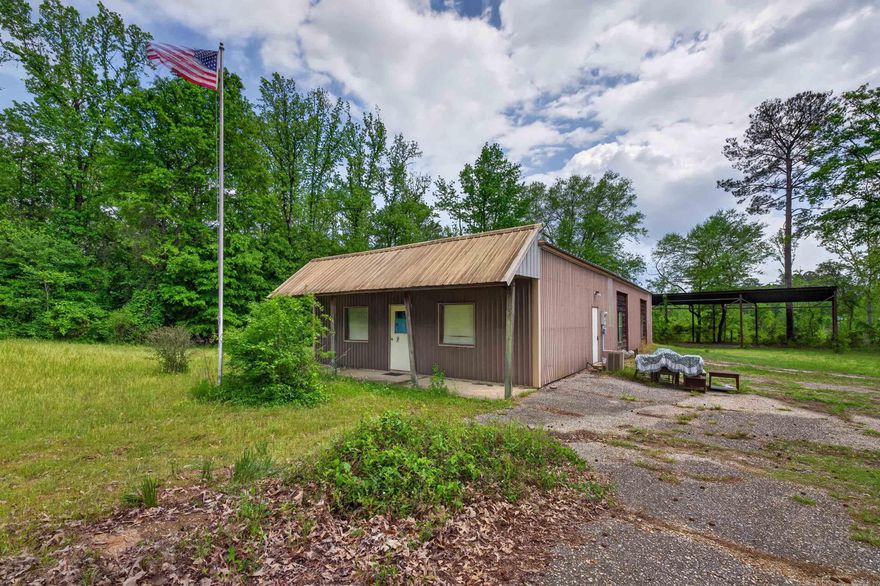 Unique opportunity just outside the city limits of Arkadelphia! This versatile commercial property, formerly known as the Woodmen of the World building, offers endless potential for business, residential conversion, or a combination of both. The main building features a flexible layout with dedicated office space as well as a large open area ???????? suited for a variety of uses including retail, event space, workshop, or even a customized living area. Whether you're looking to establish a business, create a live/work setup, or invest in a multi-use property, this one checks all the boxes. Outside, you’ll find a substantial 38x60 canopy shed—perfect for equipment storage, covered workspace, or additional business operations—along with a paved parking area providing convenience and accessibility for clients, employees, or guests. Located just outside Arkadelphia city limits, this property offers fewer restrictions while still being just minutes from town amenities, making it an ideal blend of privacy and convenience. Don’t miss your chance to own a truly adaptable property with unlimited possibilities!