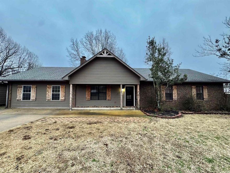 Let me tell you what your are going to LOVE about this home! This home has 3 Bedroom and 2 full baths.  You  will have a large living room  with a wood burning fireplace, and even larger Den/game room.  The kitchen-dining room combo has a breakfast bar, with the separate laundry room off the the dining area. The primary bedroom has a very large bath and access to the outside deck.   The OUTSIDE!   You will have a deck that has a beautiful view of the pond and trees and you are only minutes away from Village Creek State Park!