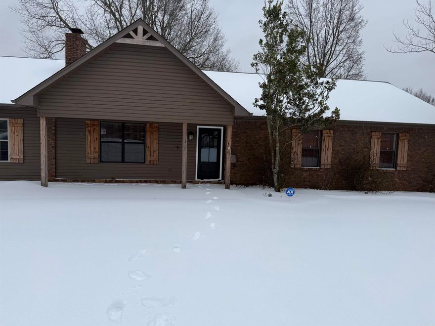 Let me tell you what your are going to LOVE about this home! This home has 3 Bedroom and 2 full baths.  You  will have a large living room  with a wood burning fireplace, and even larger Den/game room.  The kitchen-dining room combo has a breakfast bar, with the separate laundry room off the the dining area. The primary bedroom has a very large bath and access to the outside deck.   The OUTSIDE!   You will have a deck that has a beautiful view of the pond and trees and you are only minutes away from Village Creek State Park!