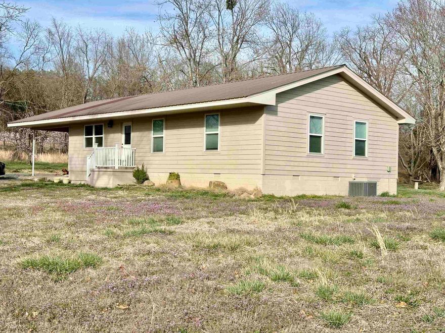 Charming Remodeled Home Just Outside Marshall, AR!  This beautifully remodeled 3-bedroom, 2-bath home offers 1,456 square feet of comfortable living space on 1 acre +/-. Located approximately 15 minutes from the Buffalo National River and a mile from Marshall, AR. This property offers the perfect mix of peaceful country living with convenient access to town and outdoor recreation.   Enjoy scenic views of the surrounding mountains right from your doorstep. The property features a storm shelter for added peace of mind and fruit trees, including an apple tree and two peach trees, perfect for enjoying fresh fruit in your own backyard.  Don’t miss out on this cozy home in a serene setting—just minutes from all that Searcy County Arkansas has to offer.