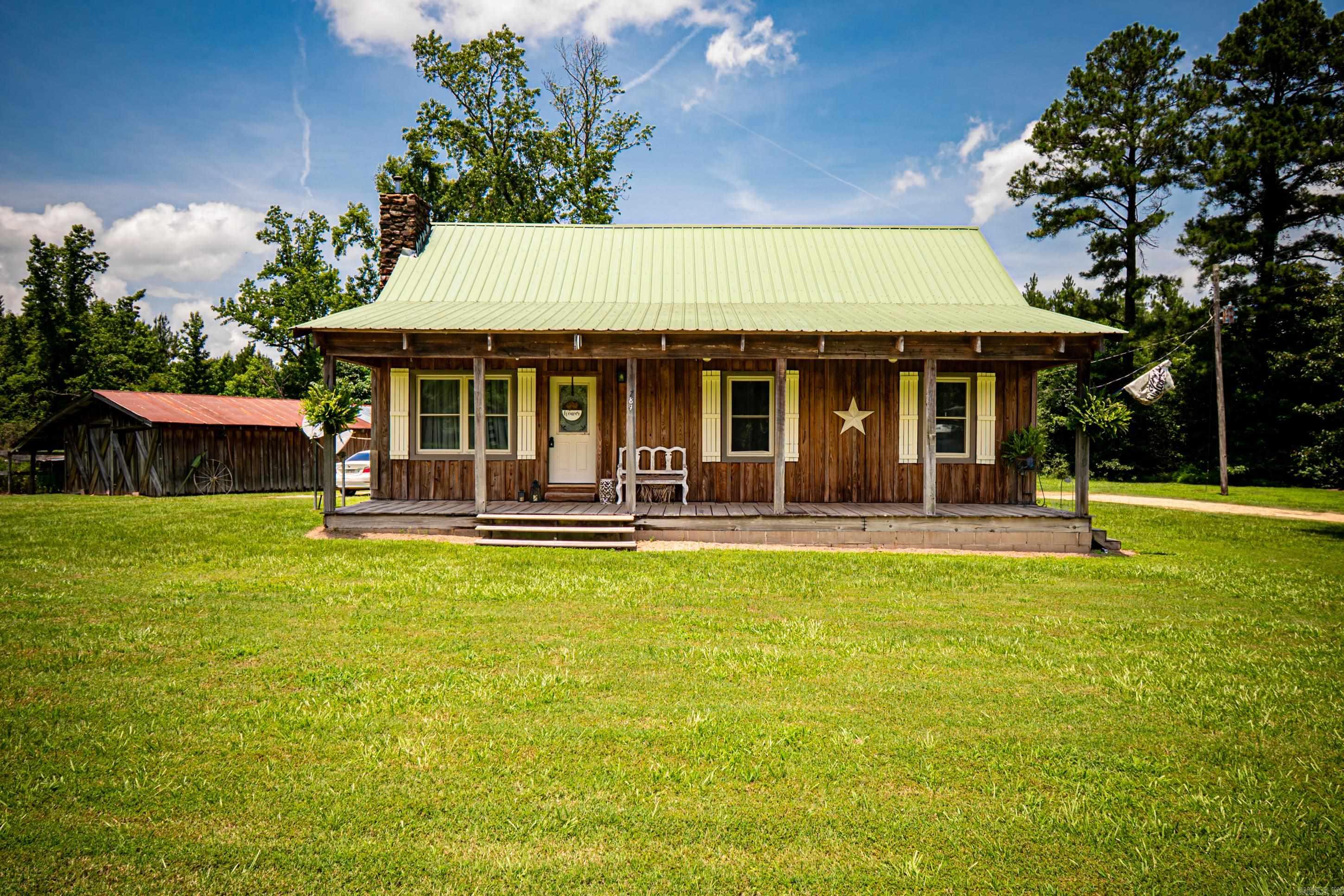 Welcome to 780 Bradley 7 Rd South in Warren, AR – a beautifully updated 3-bedroom, 2-bathroom home nestled on 2.3 peaceful acres. Step inside and you’ll immediately notice the fresh updates throughout, including new flooring, modern cabinets, stylish appliances, and stunning wood accents on the walls and ceiling that give this home a warm, rustic feel. Outside, the spacious acreage offers plenty of room to roam, garden, or entertain, and includes not one, but two barns—perfect for storage, hobbies, or small livestock. Whether you’re looking for a quiet retreat or a place to start your next adventure, this property offers the best of country living just minutes from town. Don’t miss your chance to own a piece of the countryside with modern comforts already in place. Schedule your showing today!