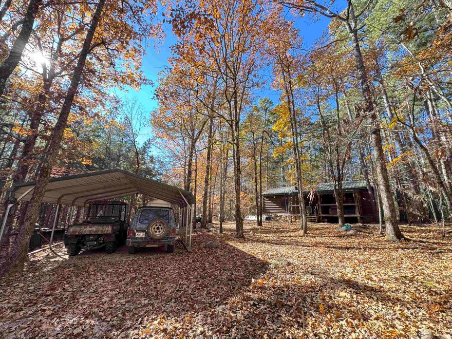 Get ready for the ultimate outdoor adventures with approximately 1.2 million acres of National Forest to hunt and explore public land. Discover hunter's haven in Jerusalem, Arkansas, just 2 miles from the national forest, offering endless opportunities for hunting, fishing, hiking, swimming, and ATV exploration. This cozy cabin boasts two bedrooms, one bath, an open floor concept plan, a 2- car carport, storages buildings, a smokehouse, sets on 2 1/2 acres, complete with appliance, and furnishing. Petit Jean Electric high speed fiber internet, PJE Eclectic, city water, and ready for you to make unforgettable memories. Don't miss out on this exciting opportunity.