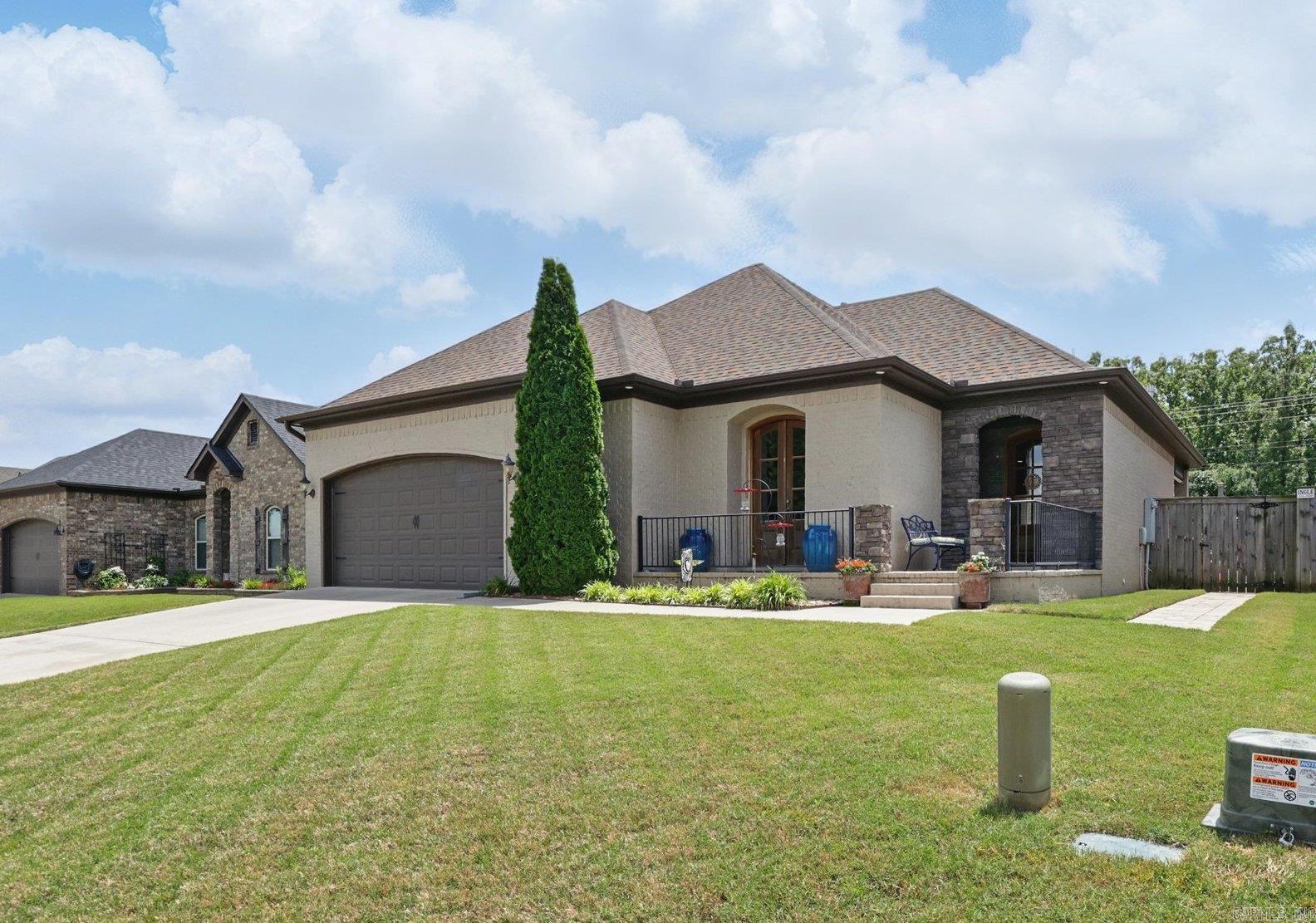 GORGEOUS custom built home! Open floor plan with 3 bedrooms and amazing backyard, porch and patio space perfect for entertaining! Primary bedroom and bath are amazing. You'll die when you see this HUGE primary closet!! Also hard to find homes with walk up attic stairs and this one has them! Newer roof about 2 years old! Hand scraped hardwood floors and beautifully stained kitchen cabinets! High quality craftsmanship and it shows!