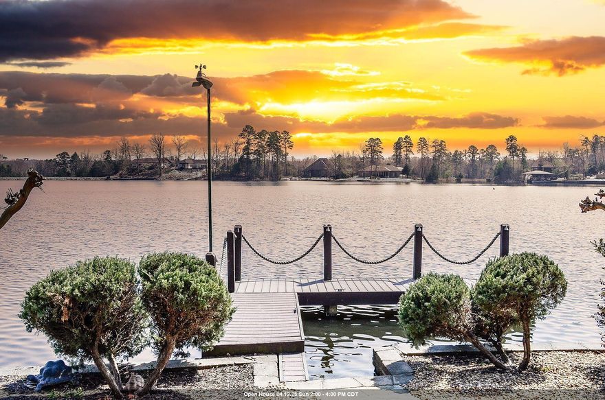 Lakefront luxury on Lake Sophia! This Renaissance-built home showcases classic French European architecture with 4 bedrooms and 4.5 baths, each bedroom featuring a private en-suite bath for added comfort and privacy. The open-concept central kitchen is ideal for entertaining and is complemented by a spacious Butler’s Pantry for additional prep and storage. Interior highlights include a dedicated media room, a built-in office, and a FEMA-approved safe room. Step outside to enjoy covered patios, decks and a brand new flagstone patio, outdoor fireplace, and a peaceful water feature—all designed for year-round outdoor living. The property offers 174 feet of seawall with a private dock, making it perfect for lakefront enjoyment, boating, and relaxing water views. There is audio and video surveillance on the exterior of the property. Interior photos coming April 1st. Call now for your private VIP showing. See Associated Docs for full features list.