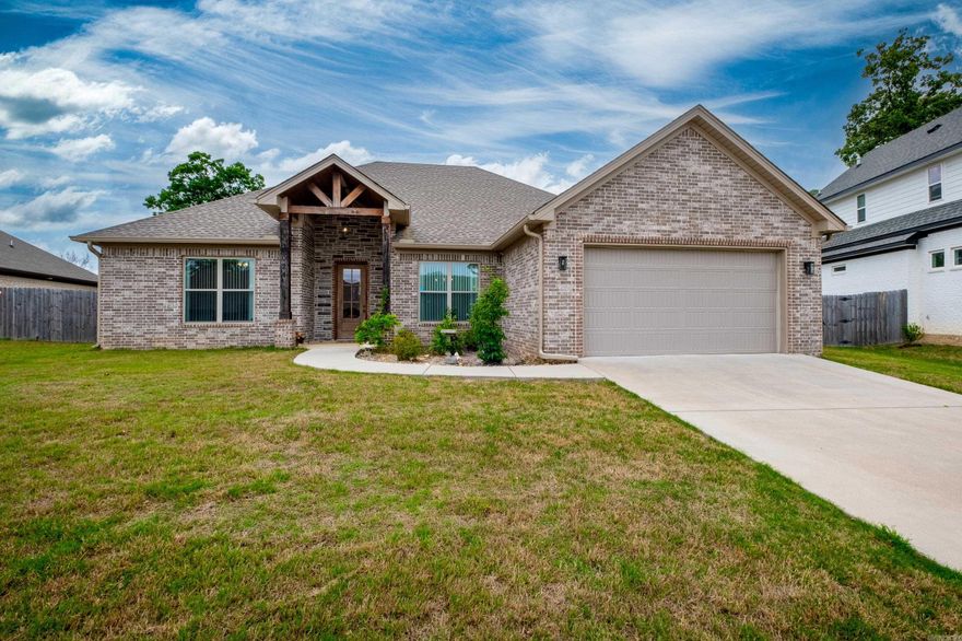 Beautiful open floorplan with high ceilings and wood beams! Located in a cul-de-sac in the back of the development, you'll enjoy hearing the frogs at night and stillness of the country and also a few minutes from everything Bryant has to offer! Split bedroom plan, all on one level with quartz and hardwood floors. The primary closet opens to the laundry room making this home absolute perfection!