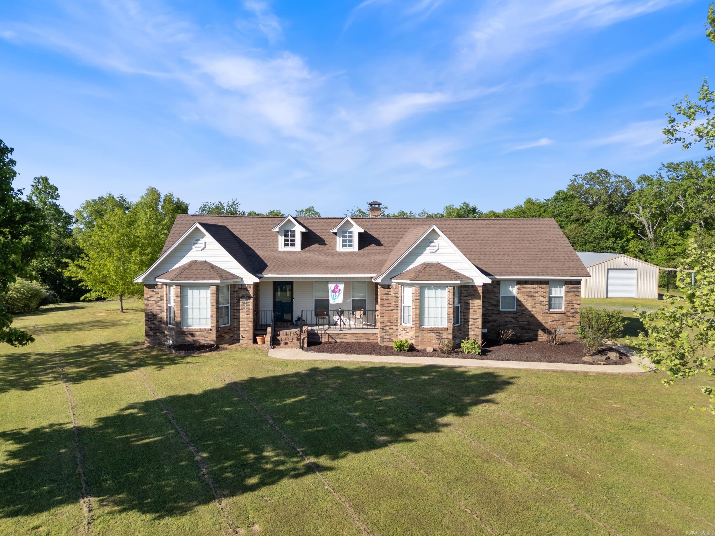 Scenic views on 5+ Acres with Shop! Enjoy peaceful country living with spectacular views on over 5 scenic acres in a quiet, sought-after neighborhood in the top-rated Greenbrier School District! This spacious home with modern finishes offers 4 bedrooms, 3 full bathrooms, and 2,515 sqft of spacious living. The chef’s kitchen includes a huge island, tons of cabinets & counter space and a Butler’s pantry across the hall. The open living room with fireplace and dining room is perfect for entertaining. The primary ensuite is its own retreat. Outside, you will love the large covered deck overlooking the large backyard and fruit trees adding charm and serenity to the property. Enjoy the above ground pool with NEW liner (2025). The massive 60x30 shop with electricity and RV carport offers endless possibilities for hobbies, storage, or workspace. Updates include: NEW roof (2 yrs), HVAC (4 yrs), NEW carpet in 3 bedrooms, NEW LVP flooring in living room, bathroom and Butler’s pantry, NEW vanity & toilet in primary bathroom, fireplace resealed, crawlspace is wrapped with dehumidifier, septic pumped (2025). Don’t miss your chance to own a slice of paradise! Agents see remarks.