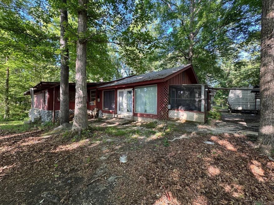 Rare opportunity to own a 0.52-acre waterfront lot with plenty of room to grow. This 1,784 sq. ft. home features a functional 4-bedroom, 2-bathroom layout, providing a solid foundation for those looking to customize a space from the ground up. While the home has seen better days and is in need of updates and a deep clean, it offers the kind of footprint and location that are increasingly hard to find.  Whether you are a seasoned investor or a DIY enthusiast ready for a major project, this property is a true "blank canvas." The interior requires extensive work to be made livable, but the payoff is a spacious home on a beautiful half-acre lot with direct water access. If you have the vision to see past the current condition and appreciate the value of a waterfront setting, this property is ready for its next chapter. Property sold as-is. Agents see showing remarks.