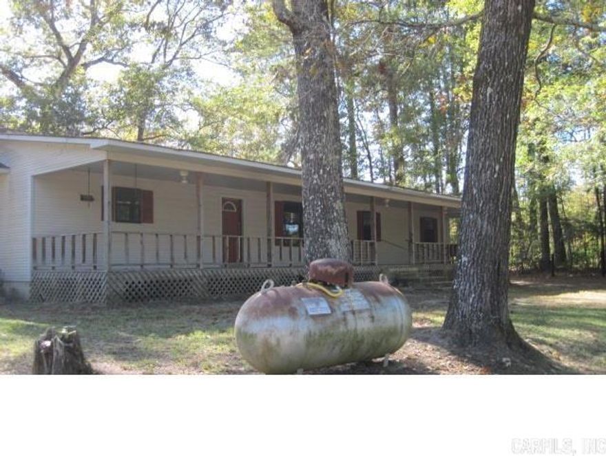 3 bedroom 2 bath home located just outside the city limits of Camden Arkansas. This home has 4 beautiful acres of land including 2 out buildings. All Realtors showing home must call Listing Agent before showing home.  36-13S-18W