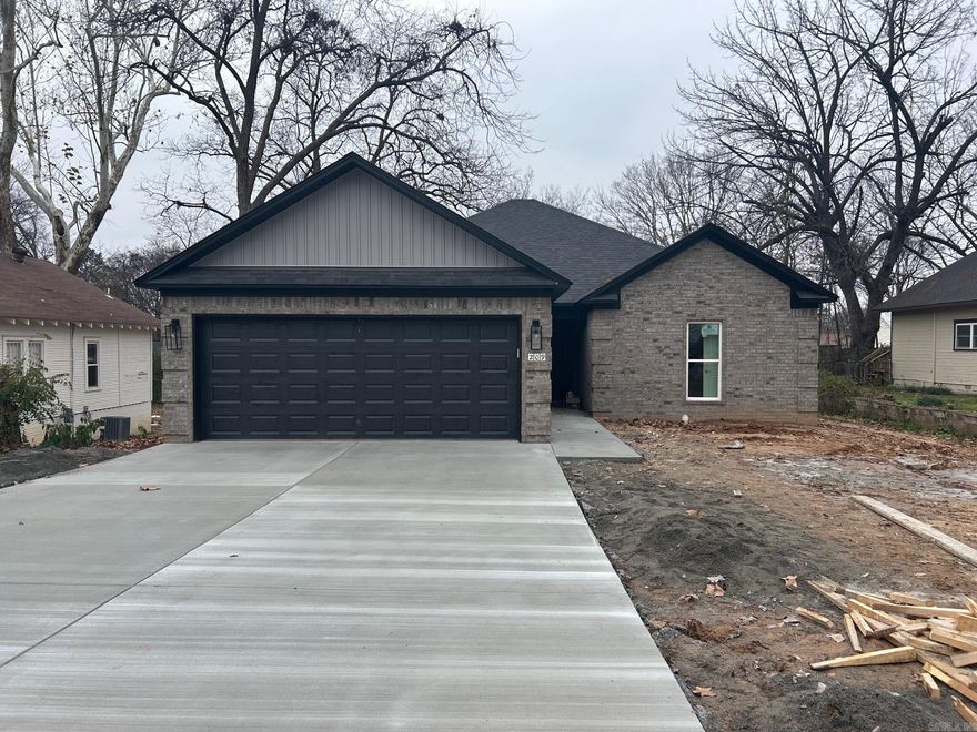 New construction homes like this one don’t come up often in Morrilton! This quality-built brick beauty by Hobbs Construction offers timeless curb appeal with a two-car garage. Step inside to an open floor plan filled with modern touches, including sleek luxury vinyl plank flooring, quartz countertops in kitchen, and stainless steel appliances. Thoughtful built-ins throughout the home add both style and functional storage. Generous walk-in closets offer plenty of room to organize, and a large laundry room adds everyday convenience with extra cabinetry and space to work. Out back, a covered patio provides the perfect spot for relaxing or entertaining year-round. Conveniently located close to downtown Morrilton, this home puts shopping, dining, and local amenities within minutes. Don’t miss your chance to make this thoughtfully designed home yours!