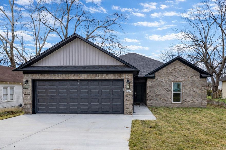 New construction homes like this one don’t come up often in Morrilton! This quality-built brick beauty by Hobbs Construction offers timeless curb appeal with a two-car garage. Step inside to an open floor plan filled with modern touches, including sleek luxury vinyl plank flooring, quartz countertops in kitchen, and stainless steel appliances. Thoughtful built-ins throughout the home add both style and functional storage. Generous walk-in closets offer plenty of room to organize, and a large laundry room adds everyday convenience with extra cabinetry and space to work. Out back, a covered patio provides the perfect spot for relaxing or entertaining year-round. Conveniently located close to downtown Morrilton, this home puts shopping, dining, and local amenities within minutes. Don’t miss your chance to make this thoughtfully designed home yours!