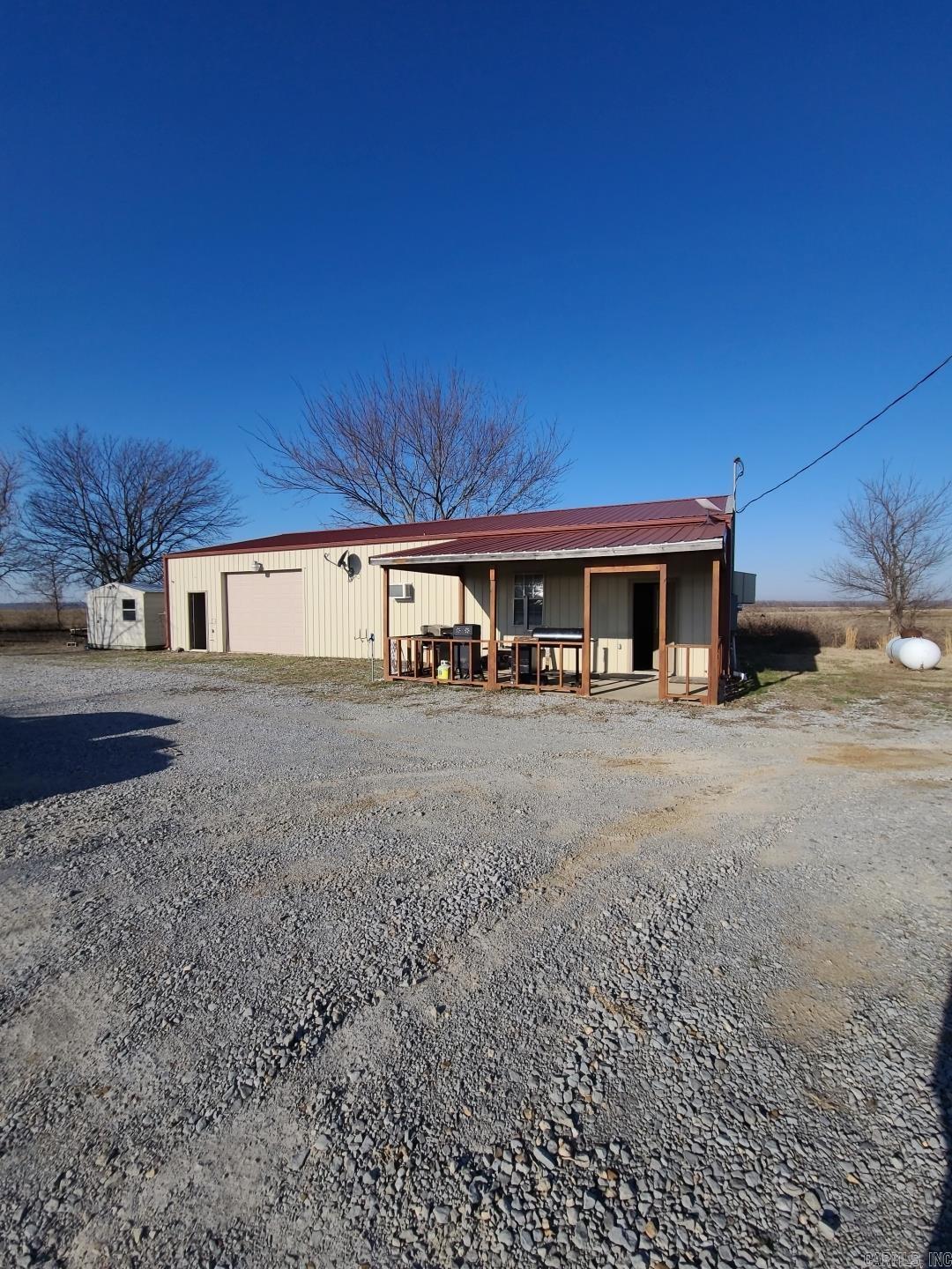 We'd like to introduce you to a fantastic property located in Northeast Arkansas, a world-renowned waterfowl hunting destination. This comfortable 2-bed, 1-bath home offers a peaceful country setting while remaining close to the Newport airport, college, popular hunting areas, and Newport's shops and restaurants. This versatile property is ideal for a hunting camp, permanent residence, or student housing. The attached shop/garage area features lockers, wader racks, an air compressor, and a large garage door, providing ample storage for all your gear. With comfortable living quarters, low-maintenance gravel lot, and prime location, this property is sure to become your go-to duck camp.
